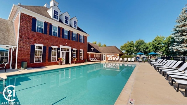 community pool with a patio area