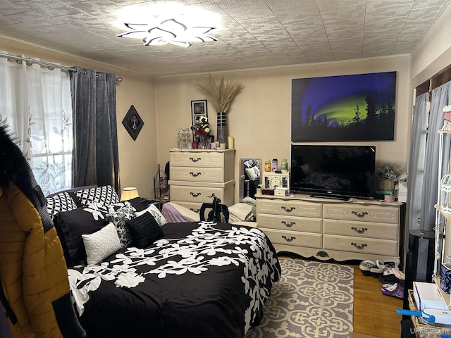 bedroom with wood finished floors