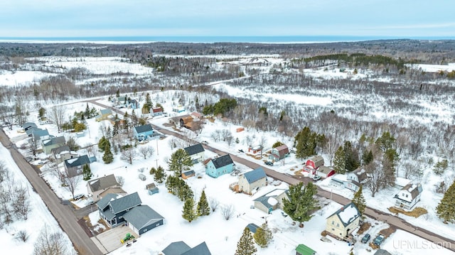 snowy aerial view featuring a residential view