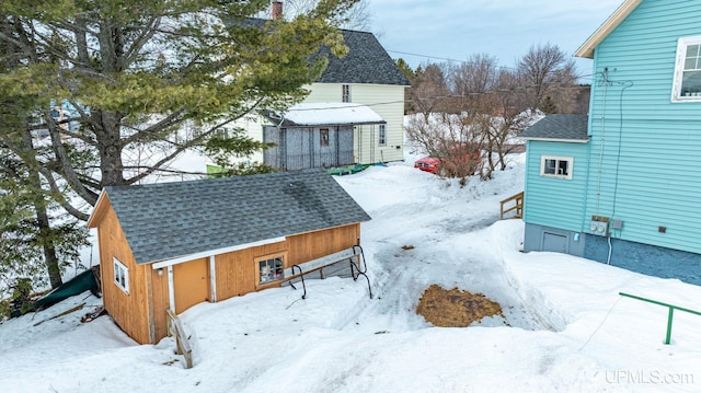 exterior space featuring an outbuilding and a storage unit