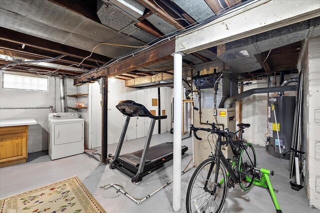 exercise area featuring washer / dryer and water heater