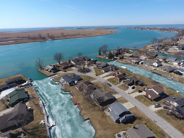 birds eye view of property featuring a water view and a residential view