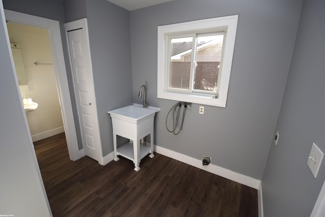 clothes washing area featuring baseboards, hookup for an electric dryer, laundry area, washer hookup, and dark wood-type flooring