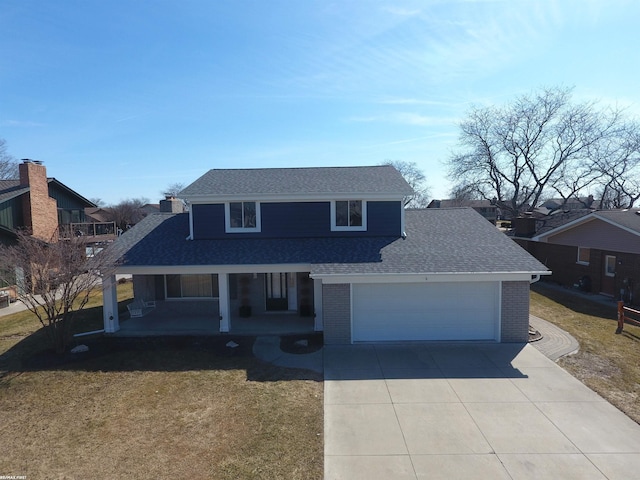 traditional home featuring a garage, brick siding, covered porch, and driveway