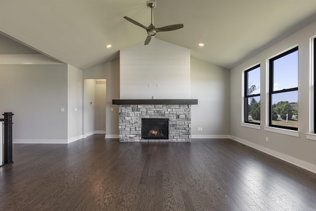 unfurnished living room with baseboards, dark wood-style floors, a fireplace, and vaulted ceiling