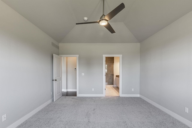 unfurnished bedroom with visible vents, baseboards, carpet floors, lofted ceiling, and ceiling fan