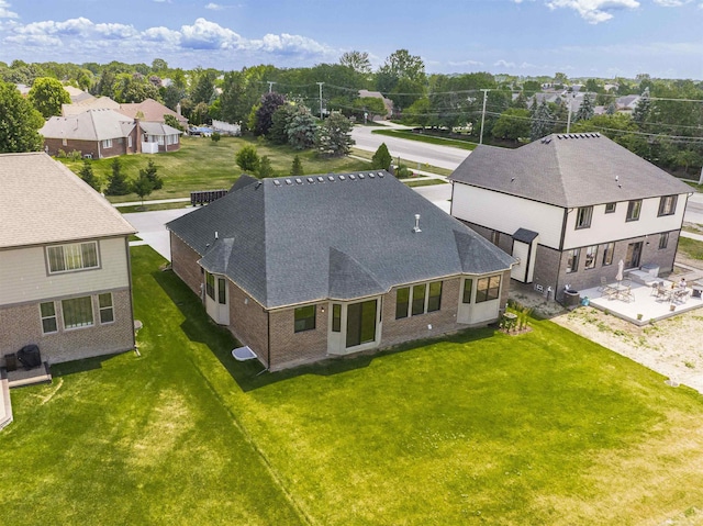 birds eye view of property with a residential view