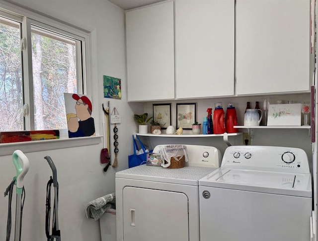 laundry room with cabinet space and washing machine and clothes dryer