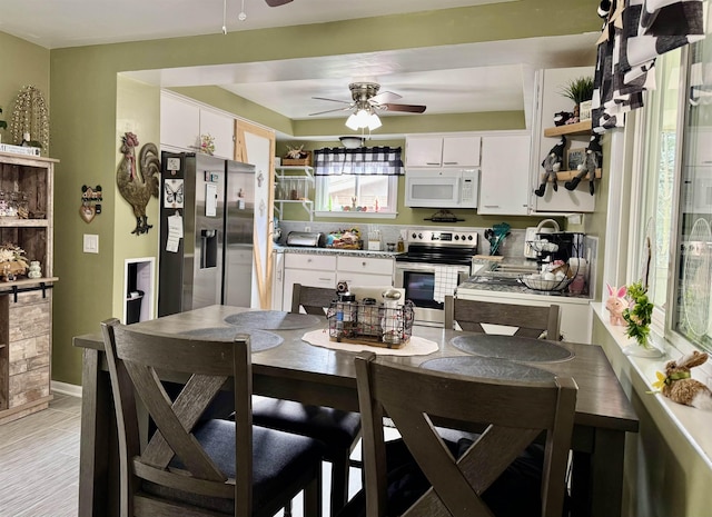 dining area with ceiling fan