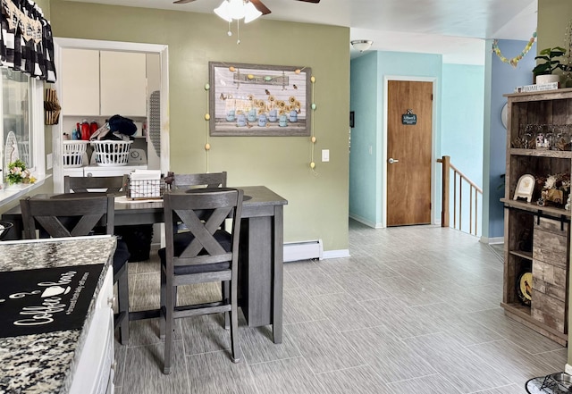 interior space with white cabinets, baseboards, baseboard heating, and ceiling fan