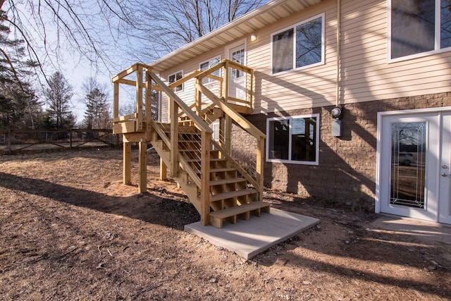 exterior space featuring stairs and a wooden deck