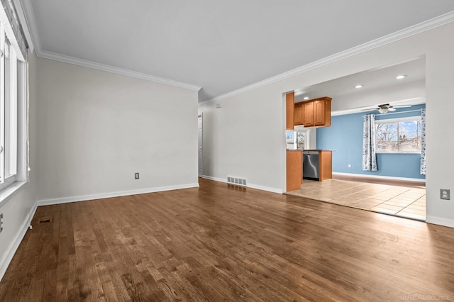 unfurnished living room with crown molding, baseboards, visible vents, and dark wood-style flooring