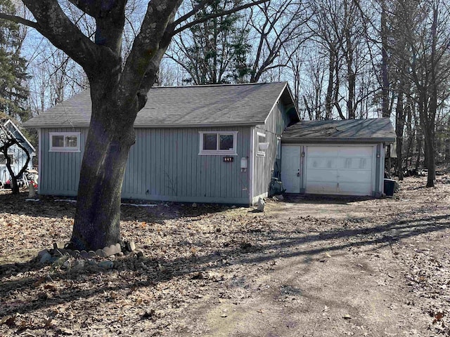 view of outbuilding with dirt driveway