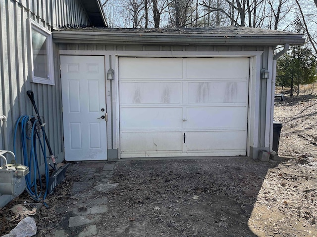 garage featuring driveway