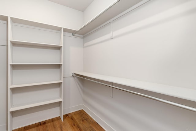 spacious closet with wood finished floors