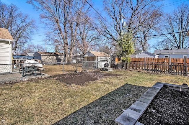 view of yard featuring an outbuilding and fence private yard