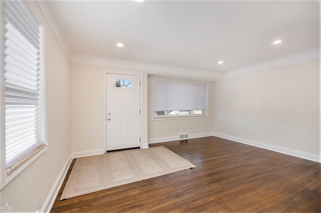 foyer entrance with recessed lighting, wood finished floors, visible vents, and baseboards