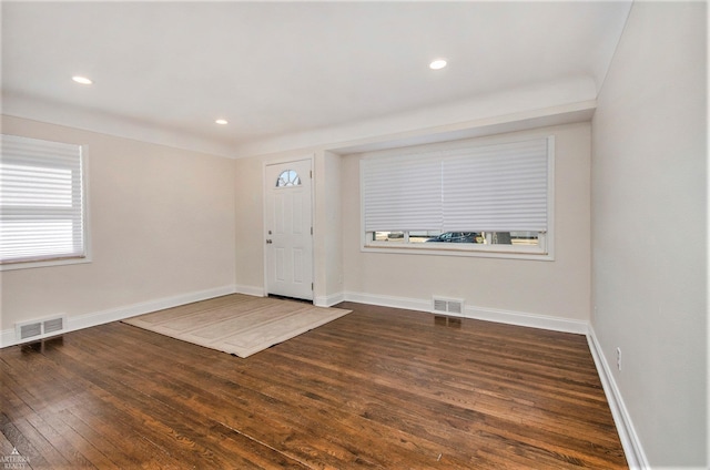 entrance foyer featuring visible vents, recessed lighting, dark wood-type flooring, and baseboards