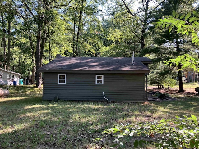 view of property exterior featuring a lawn