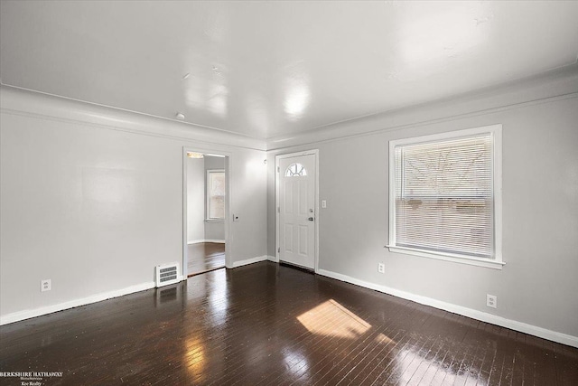 foyer featuring a wealth of natural light, baseboards, and hardwood / wood-style floors