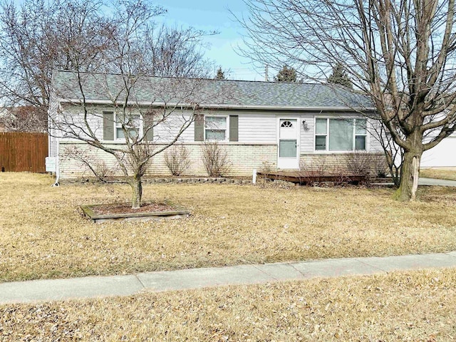 single story home featuring a front yard and fence