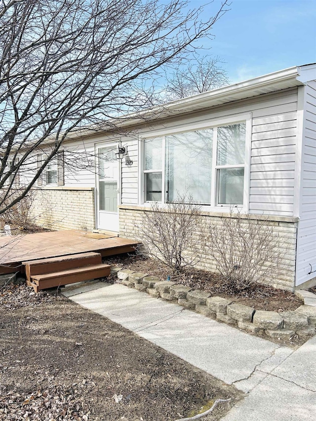 view of front of property with a wooden deck