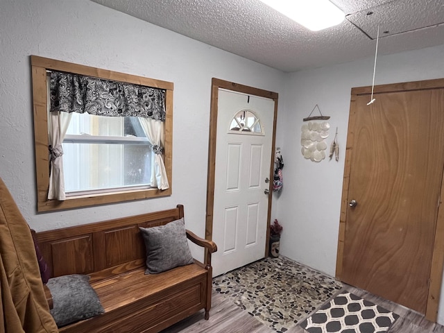 entryway featuring a textured ceiling