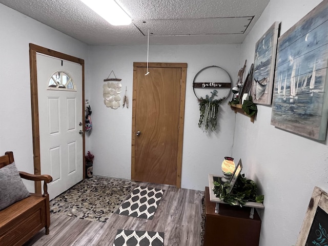 entryway with wood finished floors