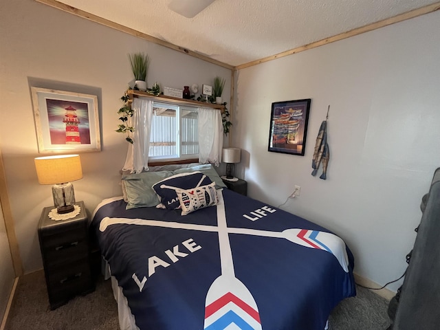 bedroom with a textured ceiling and carpet flooring