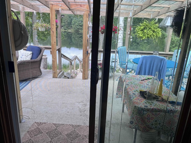 view of patio with a water view