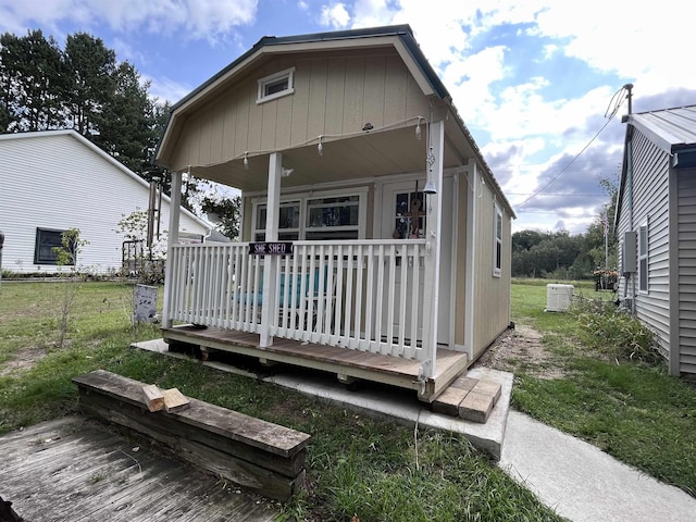 exterior space with covered porch and central AC