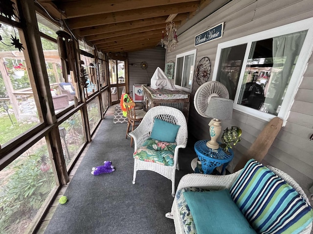 unfurnished sunroom with lofted ceiling