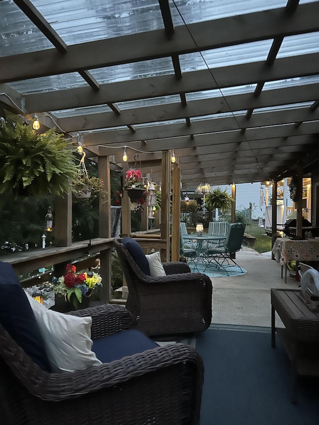 view of patio with outdoor dining space and a pergola