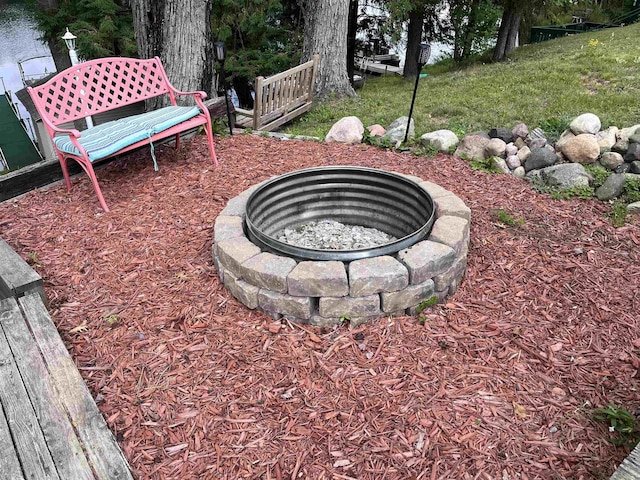 view of yard with an outdoor fire pit