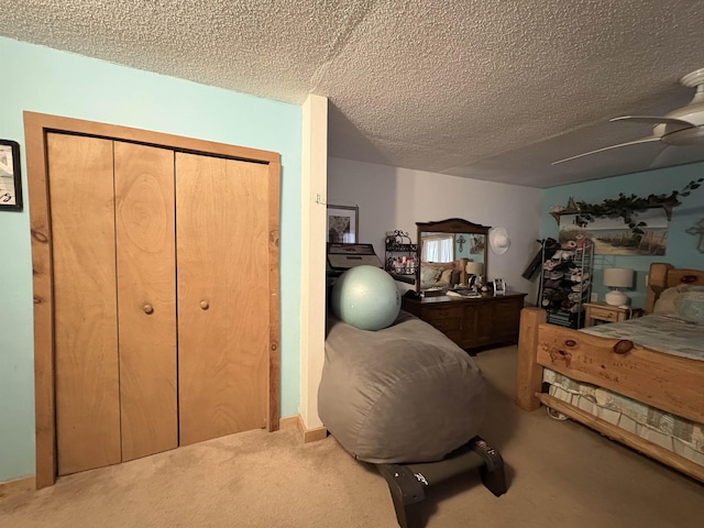 carpeted bedroom featuring a closet and a textured ceiling