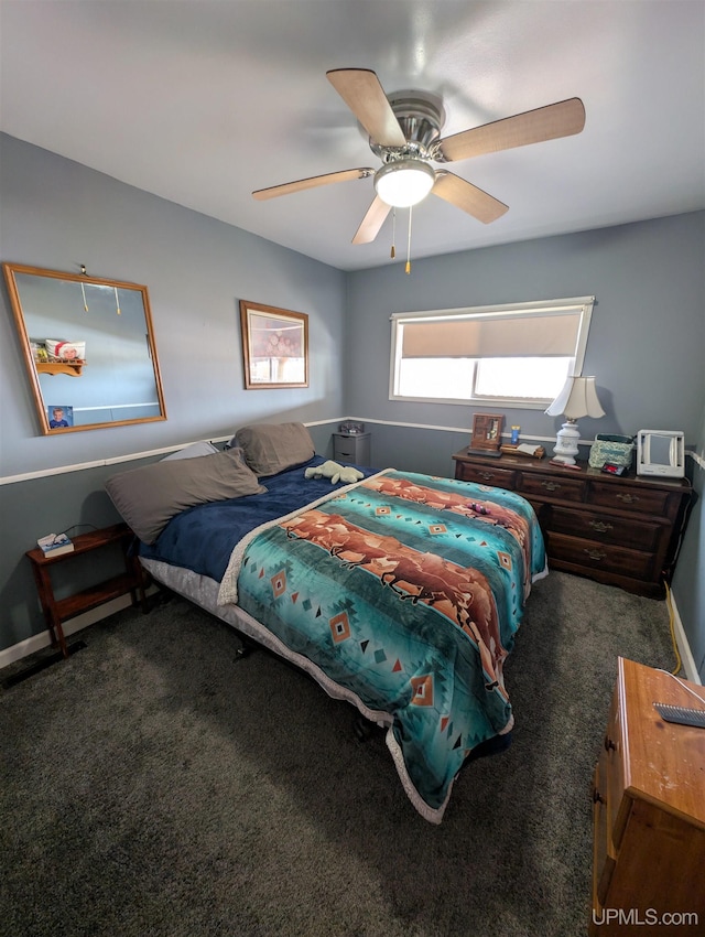 carpeted bedroom featuring a ceiling fan and baseboards