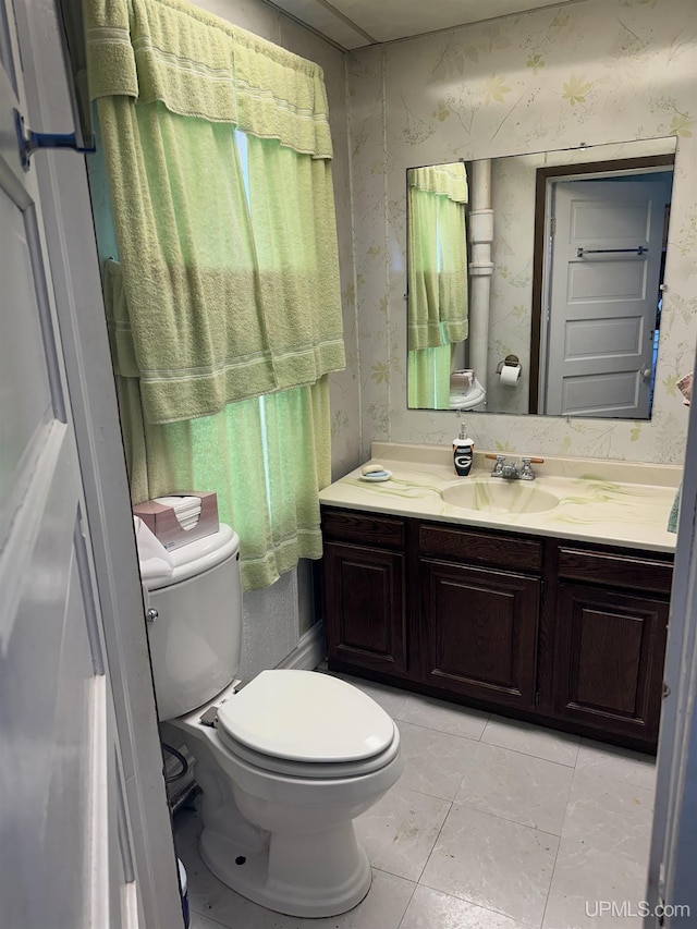 half bath featuring wallpapered walls, toilet, vanity, and tile patterned flooring