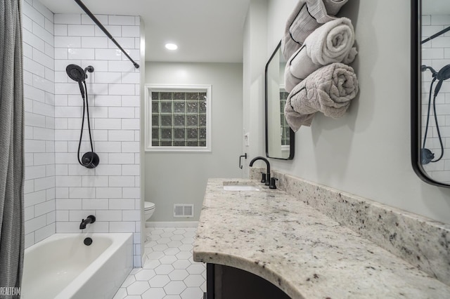 full bath featuring tile patterned flooring, visible vents, toilet, vanity, and shower / bathtub combination with curtain