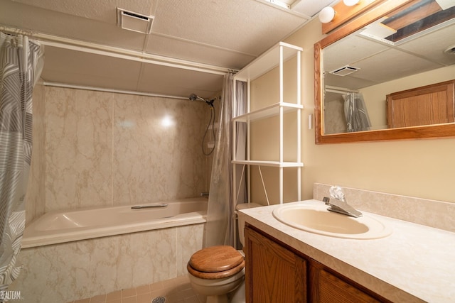 bathroom with tiled shower / bath combo, visible vents, toilet, and vanity