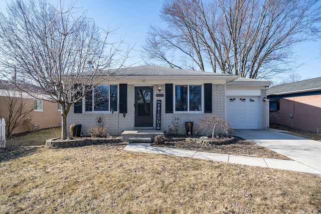 single story home with concrete driveway, an attached garage, brick siding, and a front yard