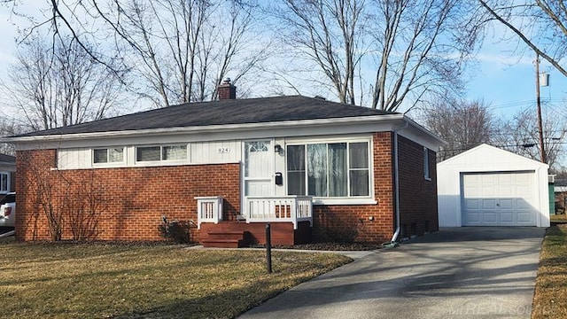 bungalow-style home featuring brick siding, a chimney, an outdoor structure, and driveway