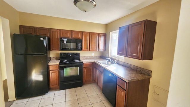 kitchen with a sink, black appliances, brown cabinetry, and light tile patterned floors