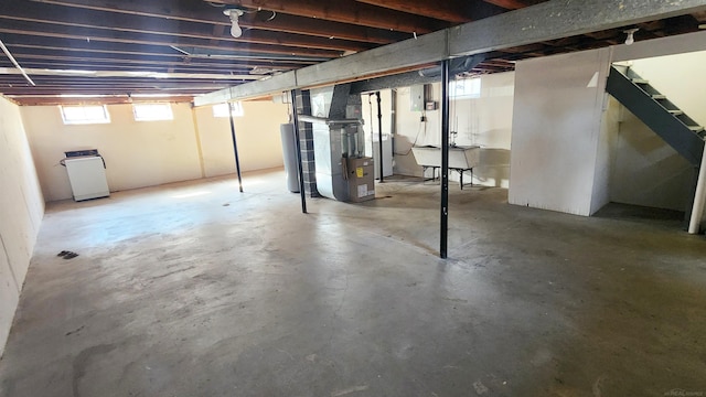 basement with heating unit and water heater