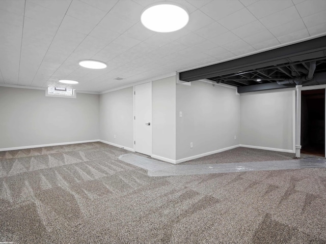 below grade area with baseboards and carpet floors