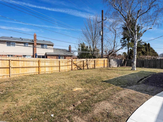 view of yard featuring a fenced backyard