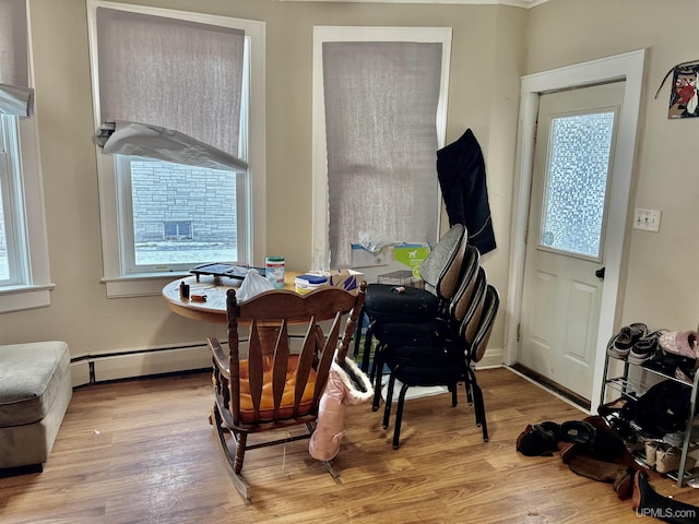 dining room featuring baseboards and wood finished floors