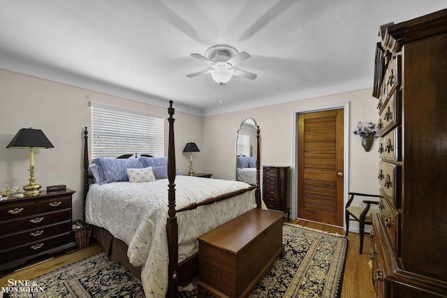 bedroom with wood finished floors and ceiling fan