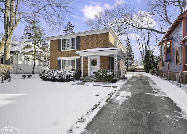 view of front of house with brick siding