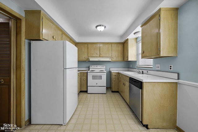 kitchen with under cabinet range hood, light floors, light countertops, white appliances, and a sink