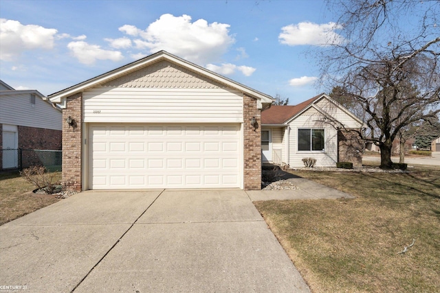 ranch-style home with a front lawn, fence, concrete driveway, a garage, and brick siding